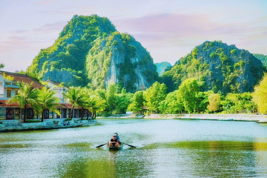 Vietnam solo travel in Ninh Binh with scenic boat ride among limestone mountains